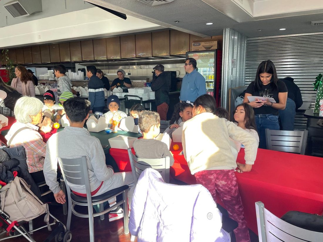 Families and volunteers gathered at a community event